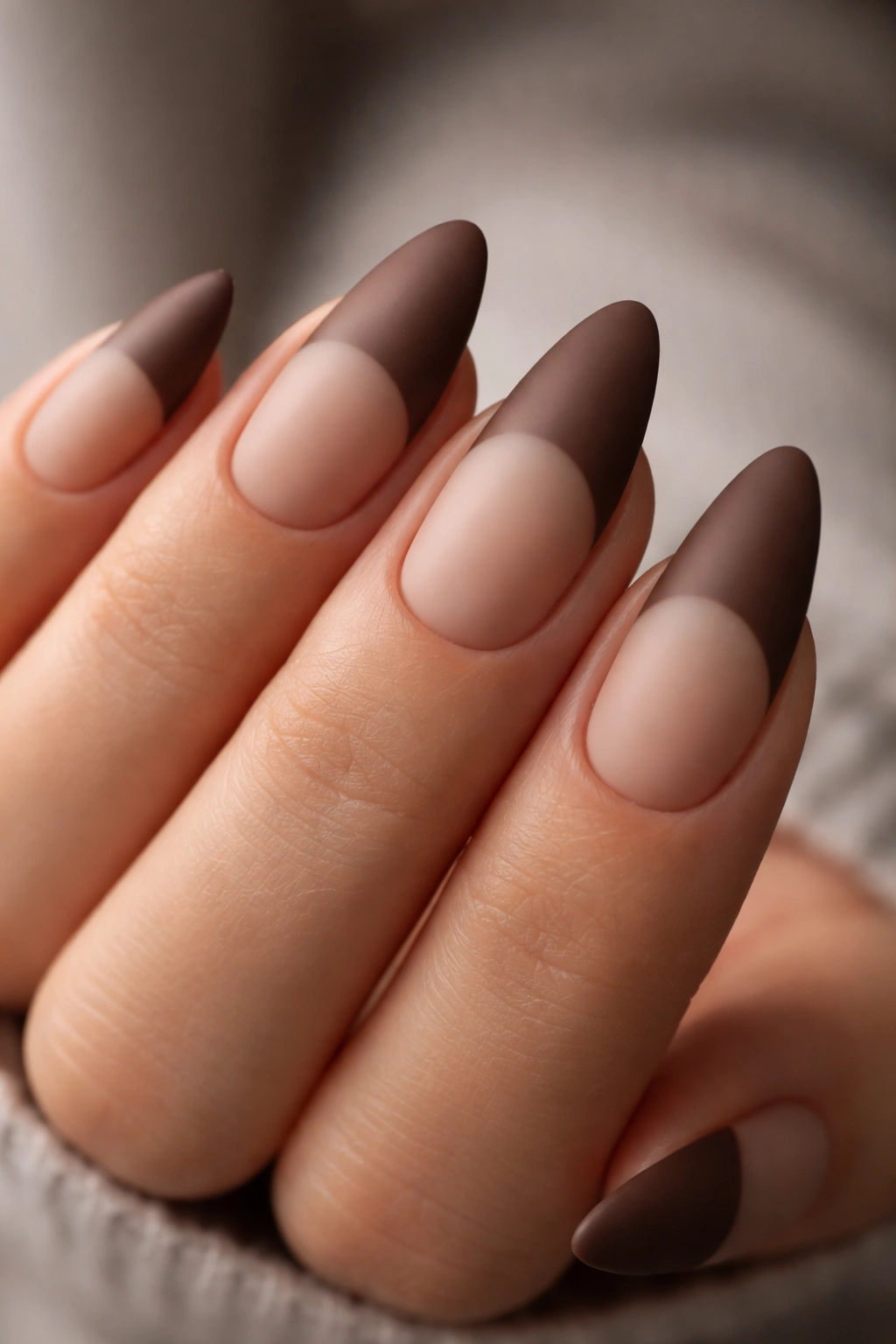 Almond nails with cocoa French tips in a matte finish