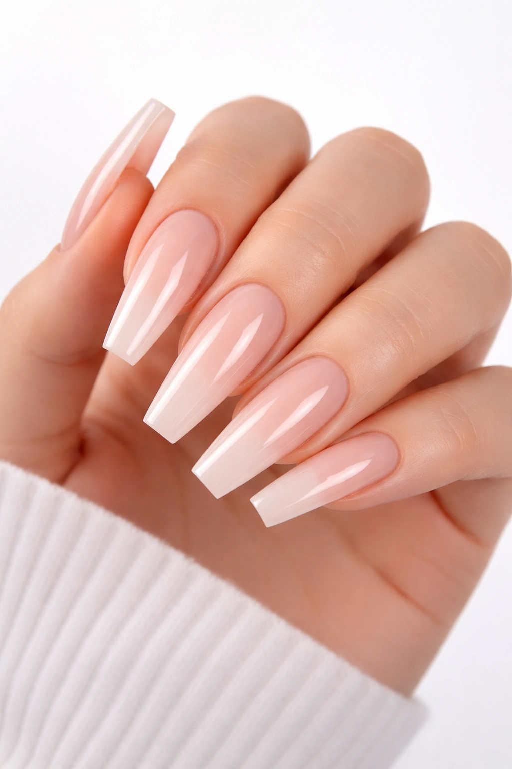 Close-up of a hand with coffin nails long and squared-off tips