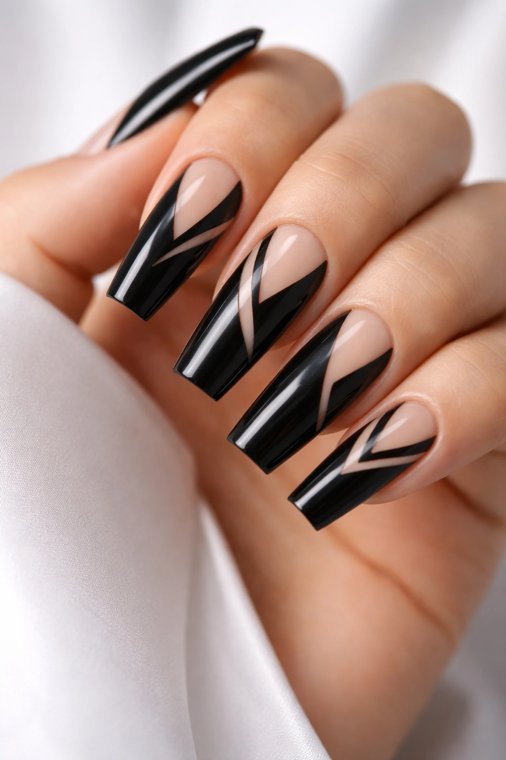 Close-up of black coffin nails with negative space design