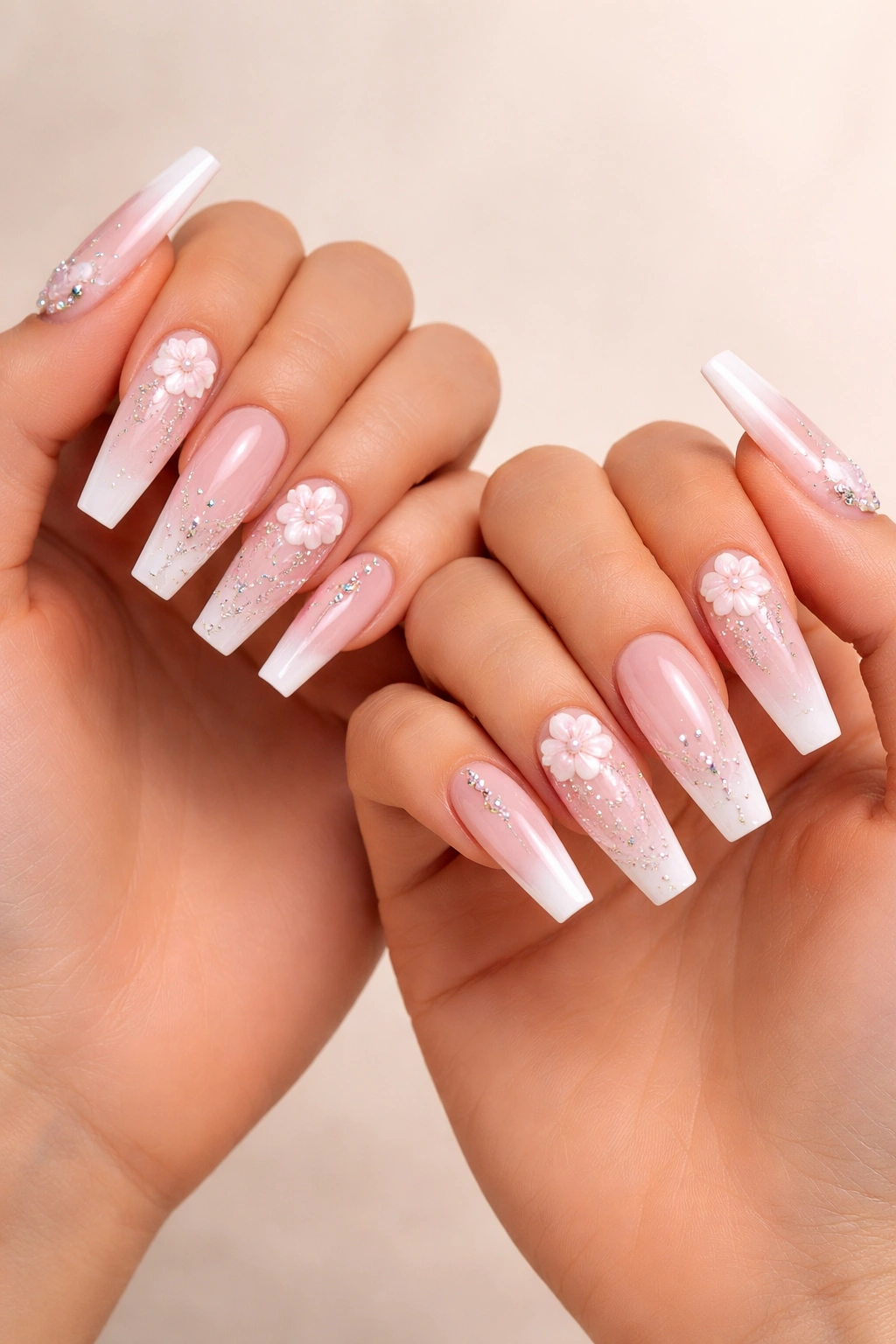 Close-up of coffin nails on two hands with matching designs for best friend coordination