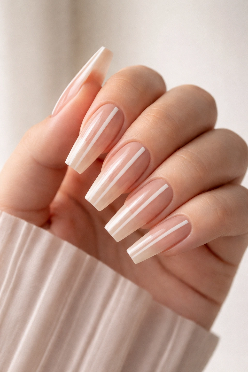 Coffin nails with vertical negative space design on nude base