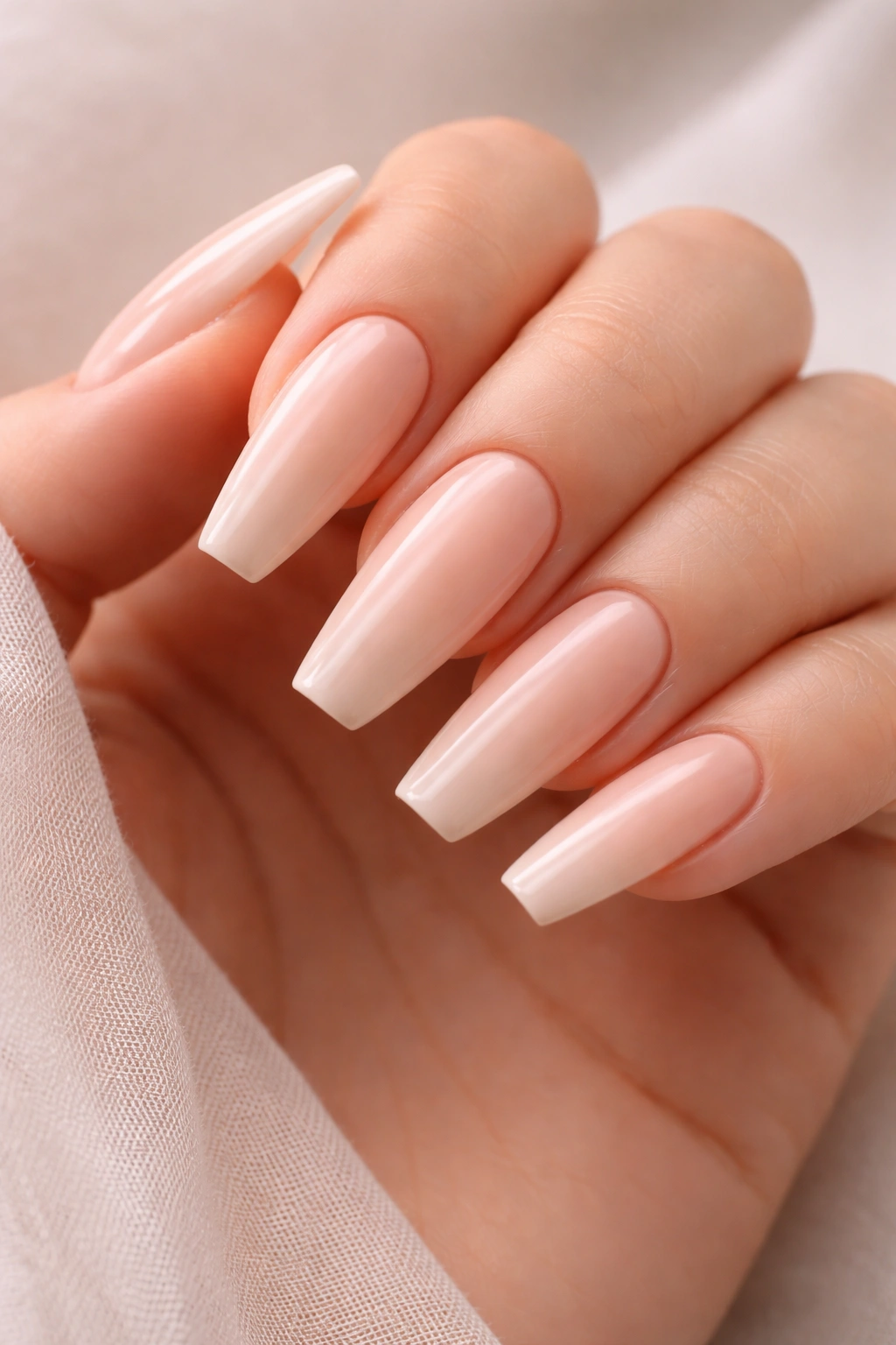 Coffin-shaped nails with nude base