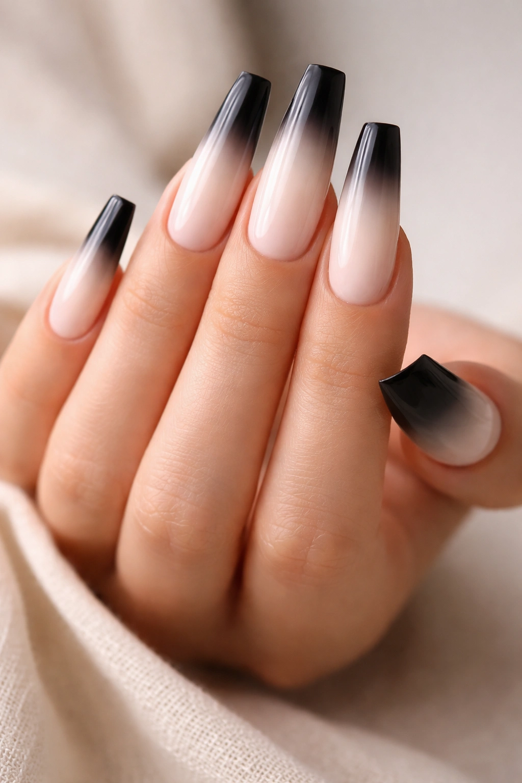 Close-up of coffin nails with black-to-white gradient at the tip