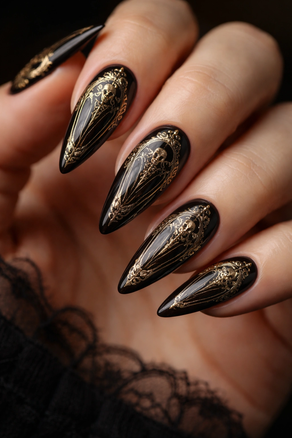 Almond coffin shaped nails with ornate gold detailing