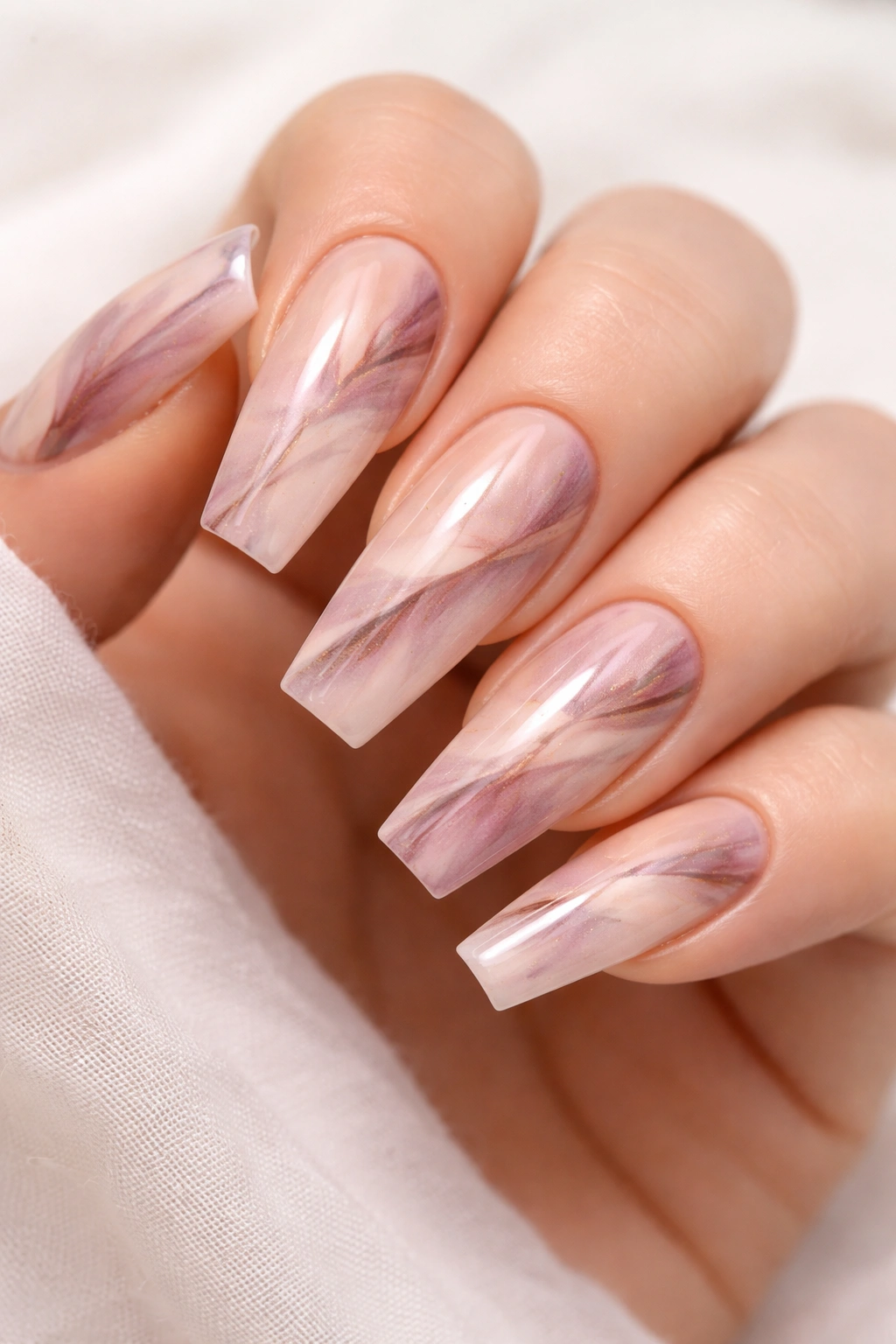 Coffin nails with abstract watercolor design on nude base