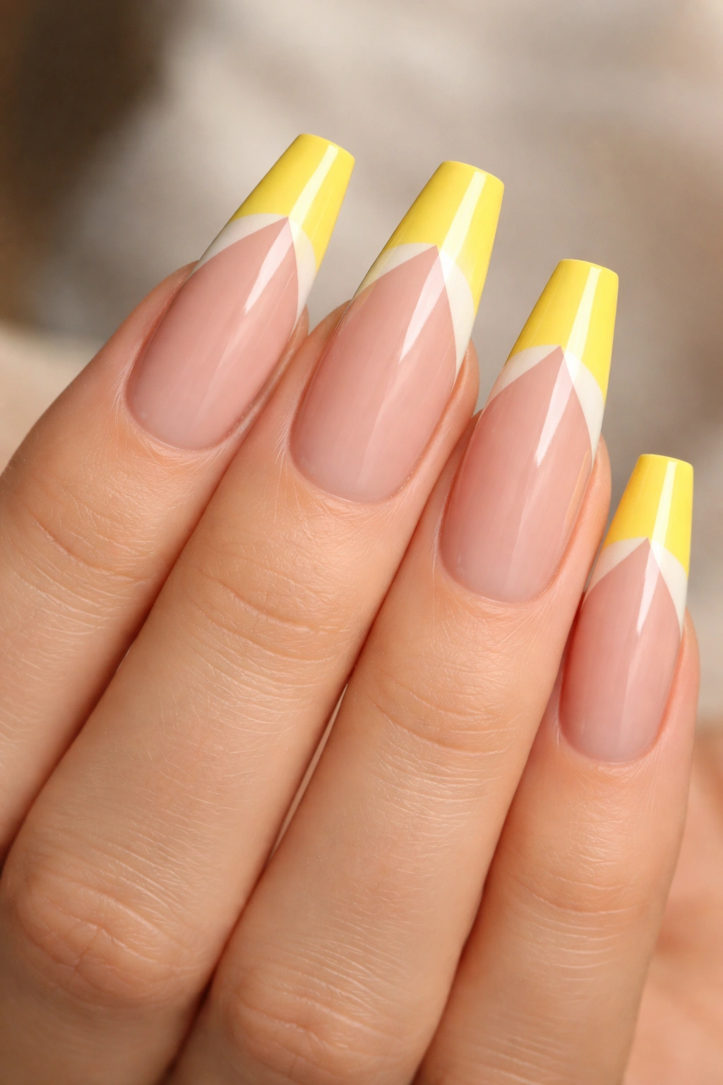 Yellow and white color-block tips on ballerina nails