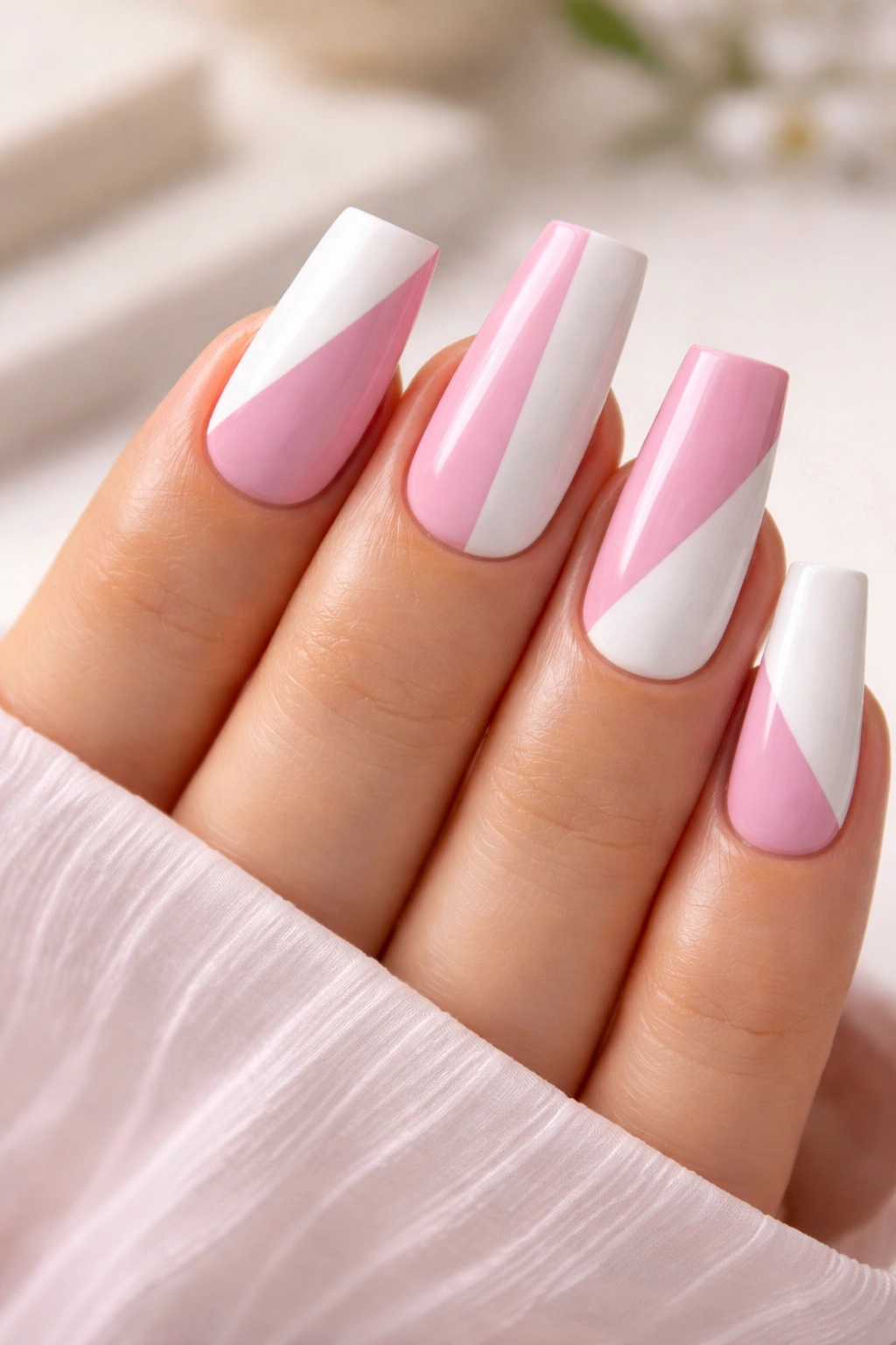 Duck nails featuring pink and white color-blocked sections with crisp lines
