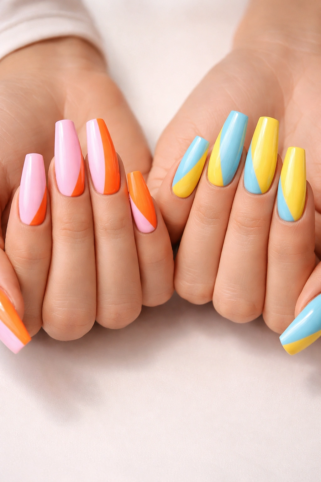 Opposite color blocking on coffin nails showcased by two hands