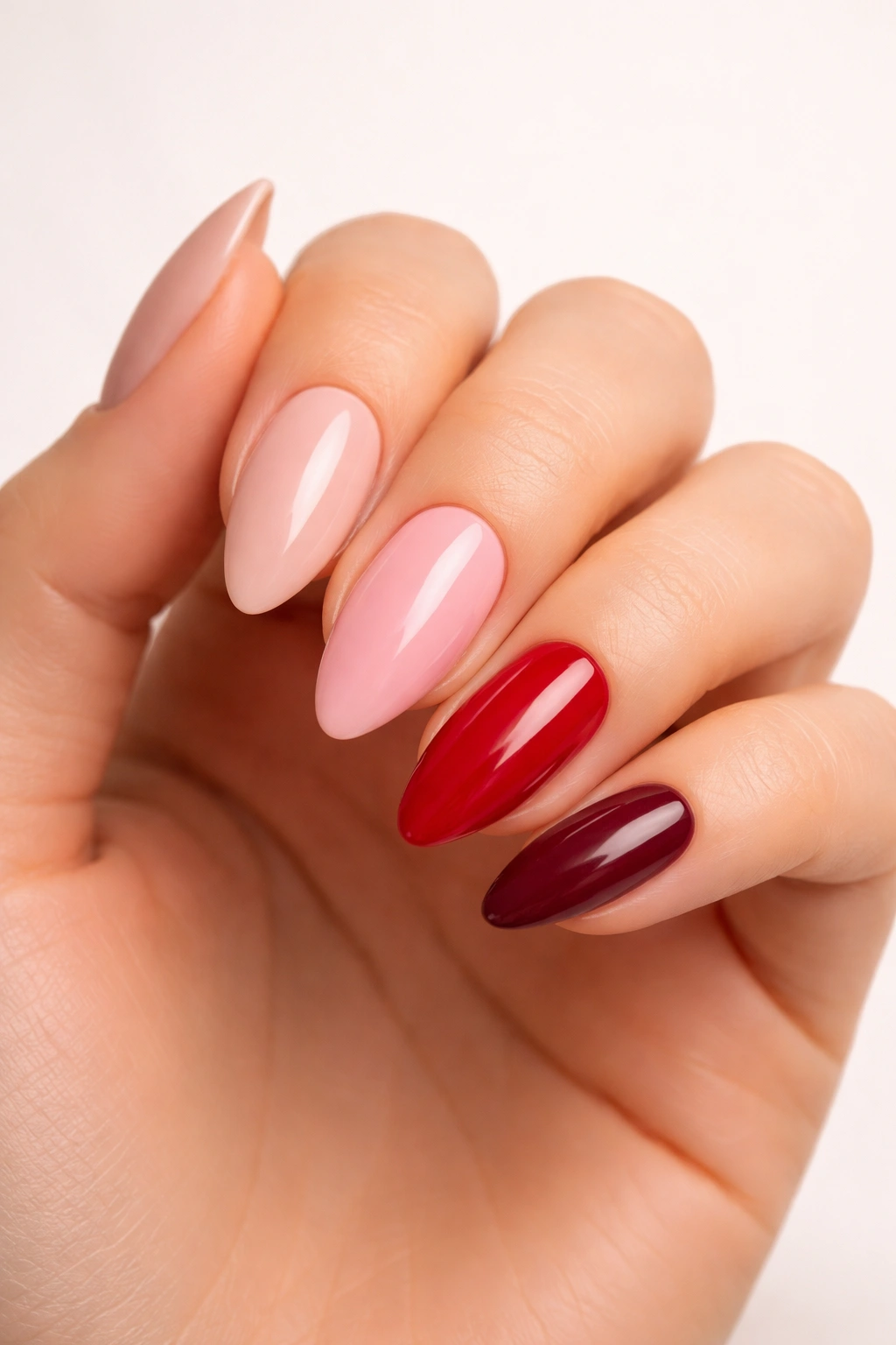 Almond nails in nude to burgundy showcasing color versatility