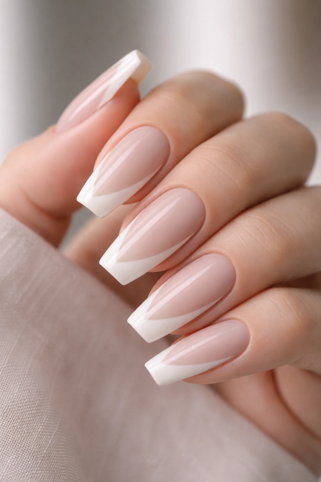 Cool beige nails with side French sweep on ballerina nails