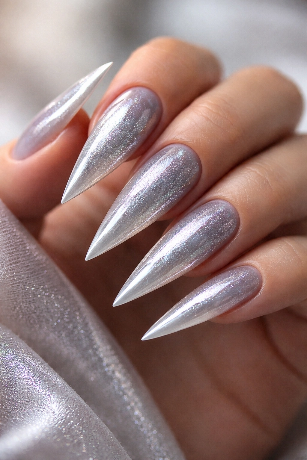 Cool grey stiletto nails with chrome dust shimmer