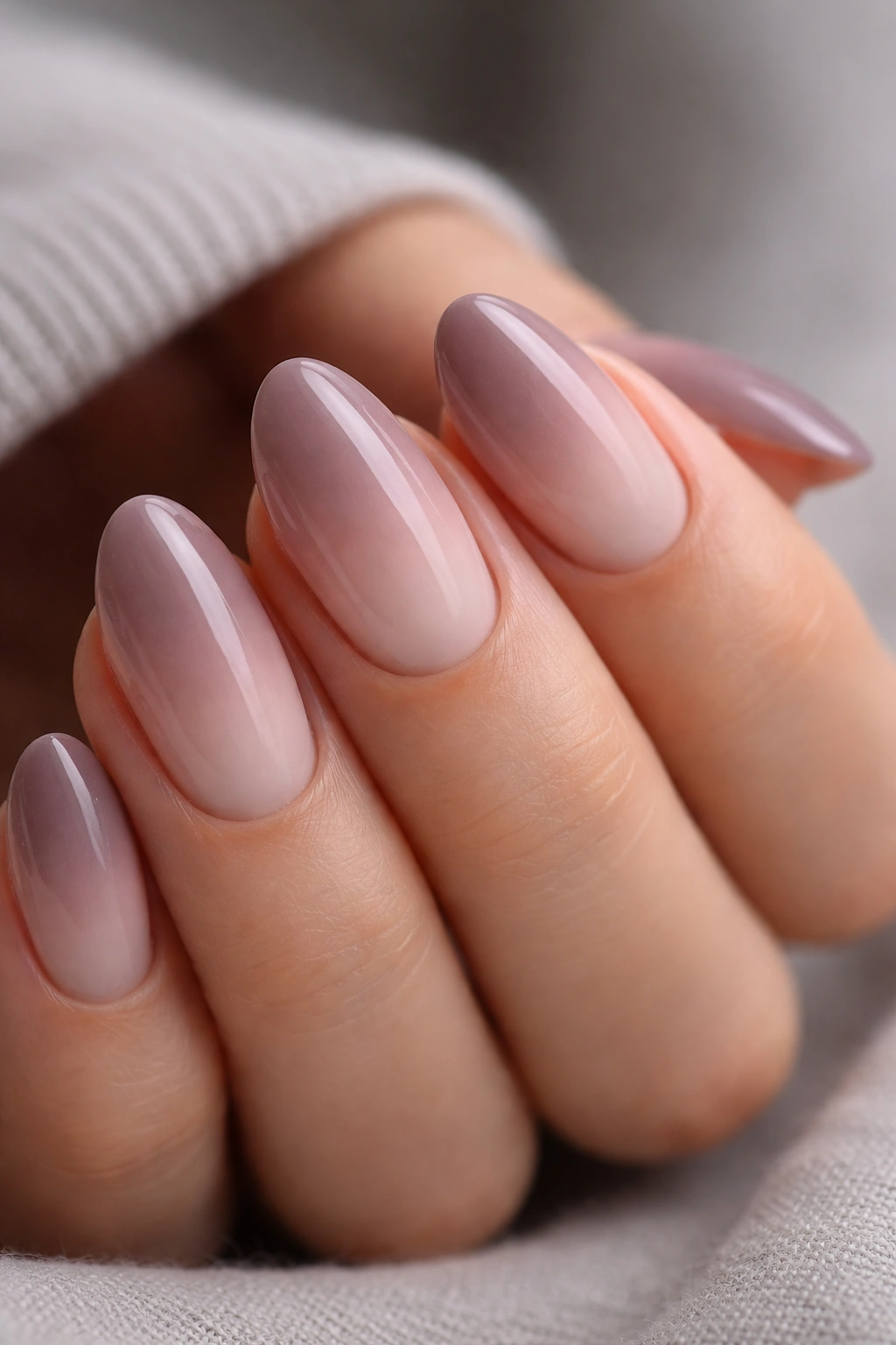 Cool mauve to sheer pink ombre on short almond nails
