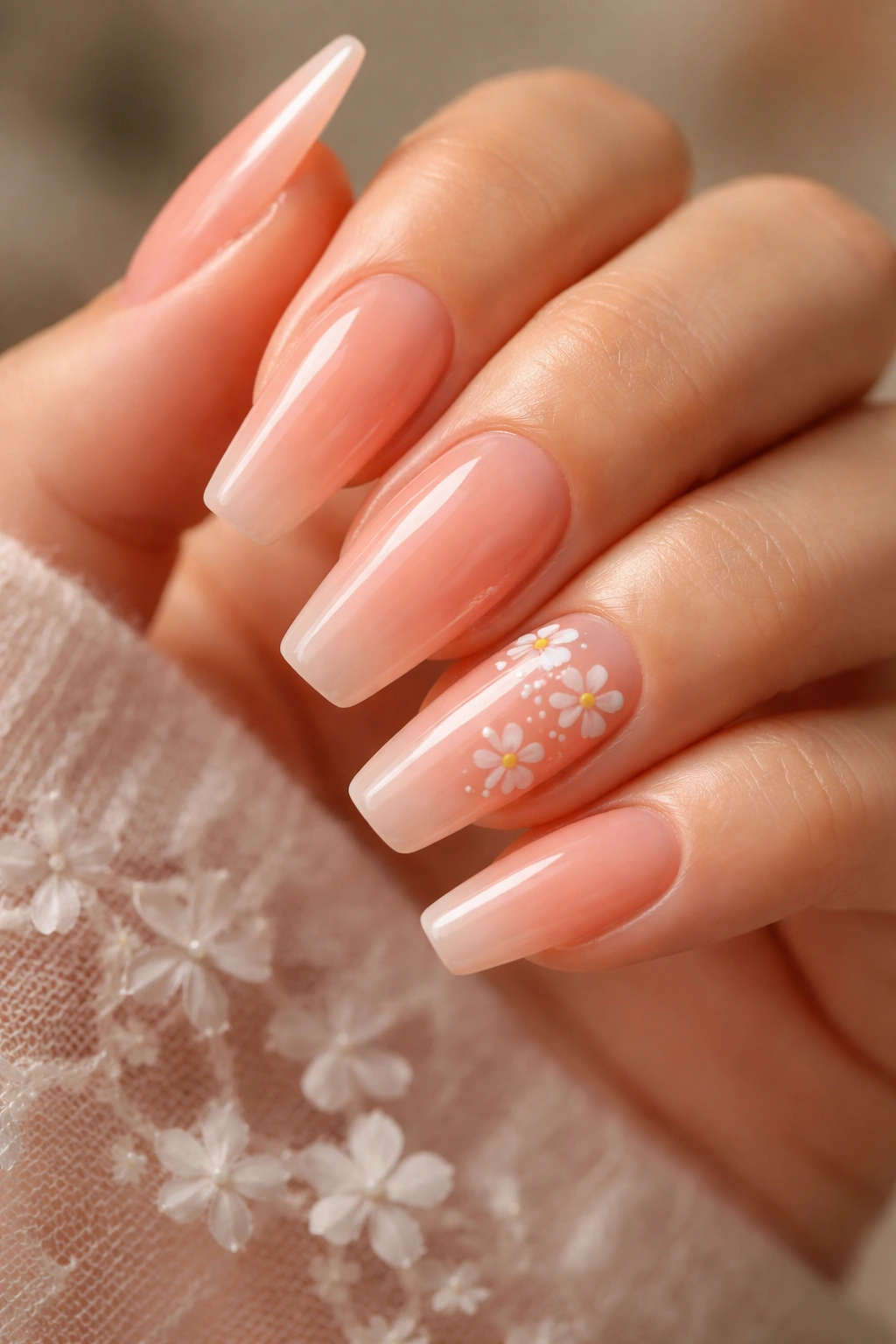 Nails with sheer coral blush and tiny white florals