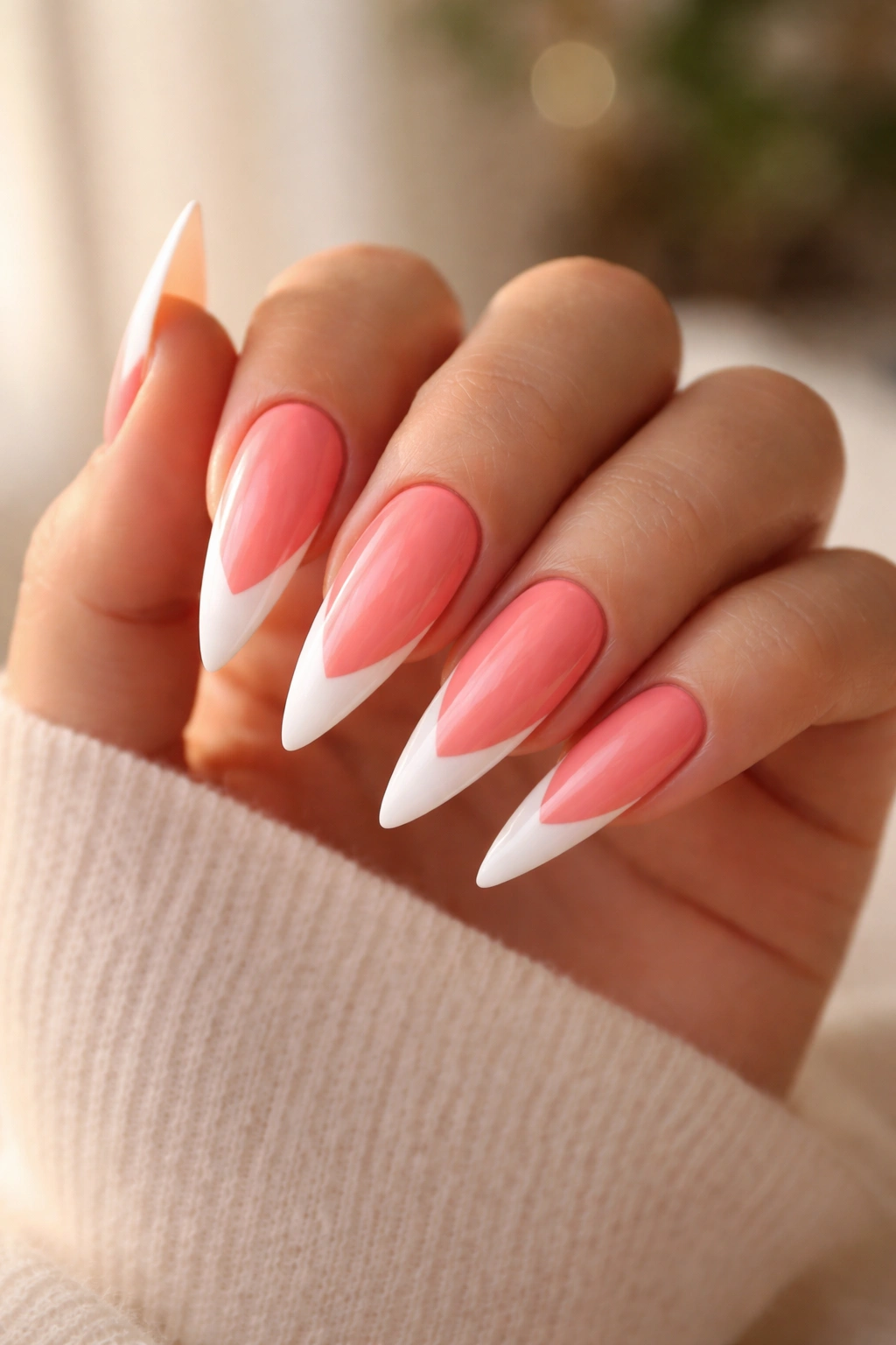 Coral pink stiletto nails with white French tips