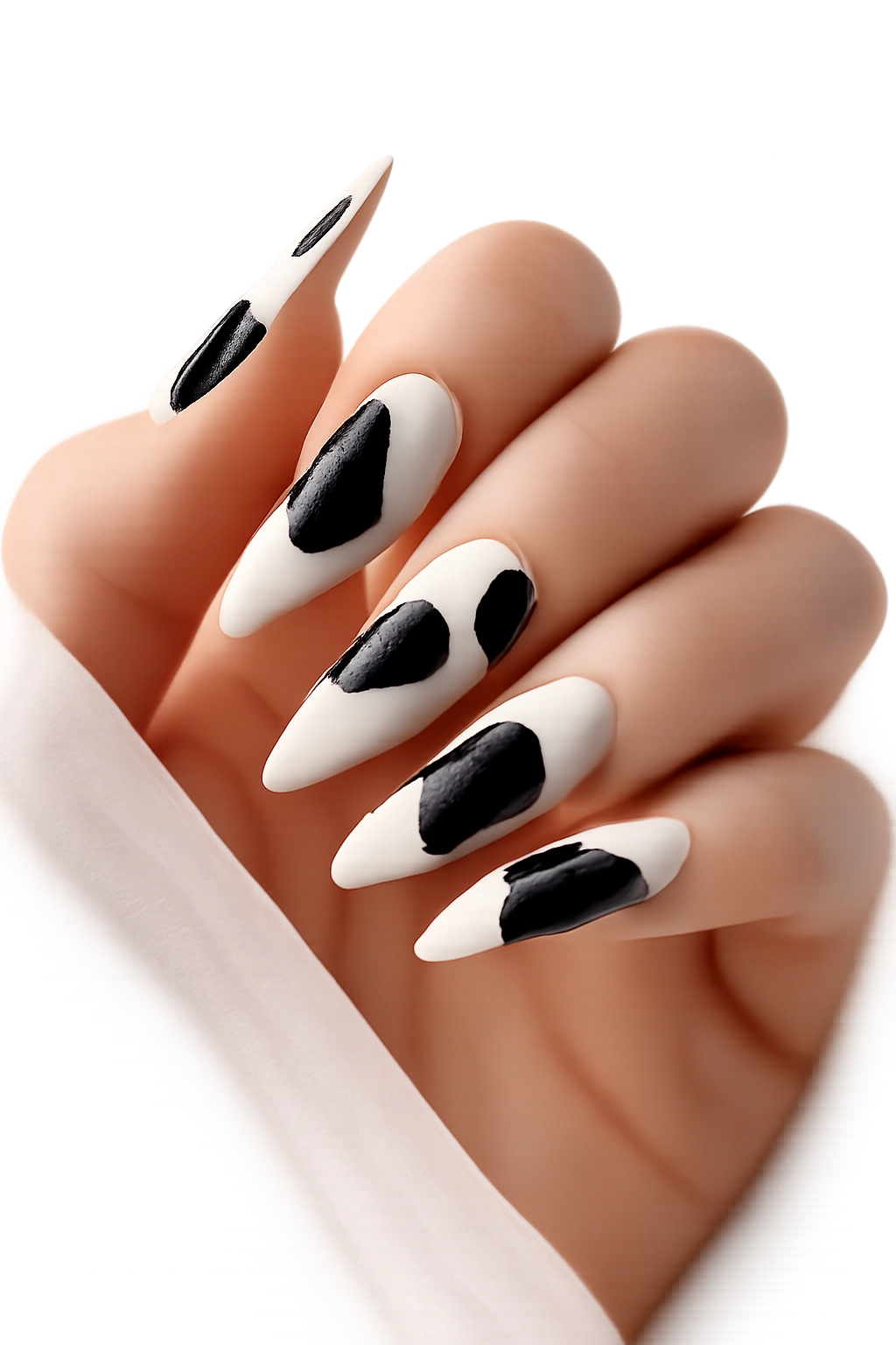 Close-up of minimal two-tone cow print nails with negative space on stiletto shape