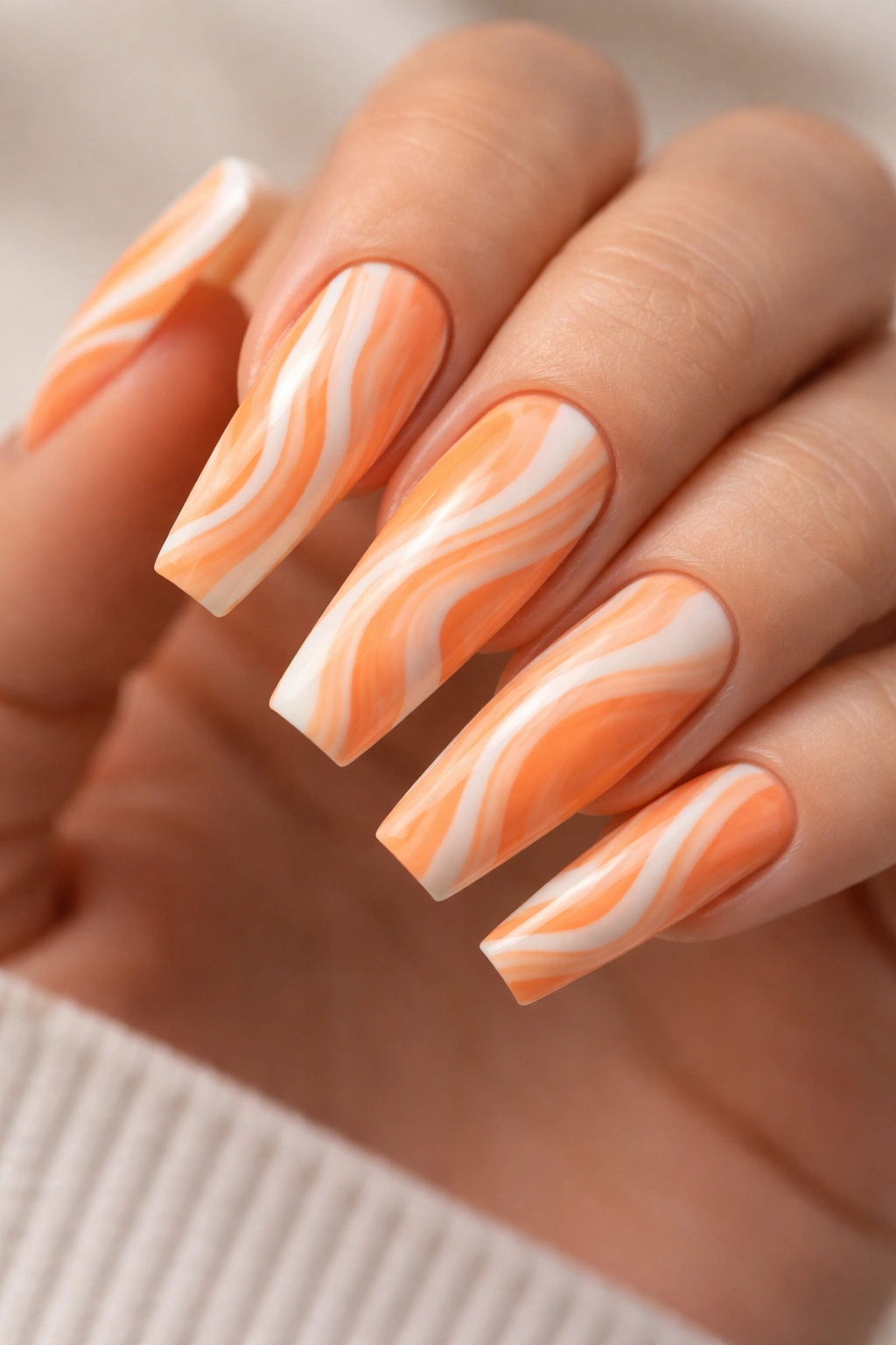 Creamsicle orange and white marble swirl on coffin nails