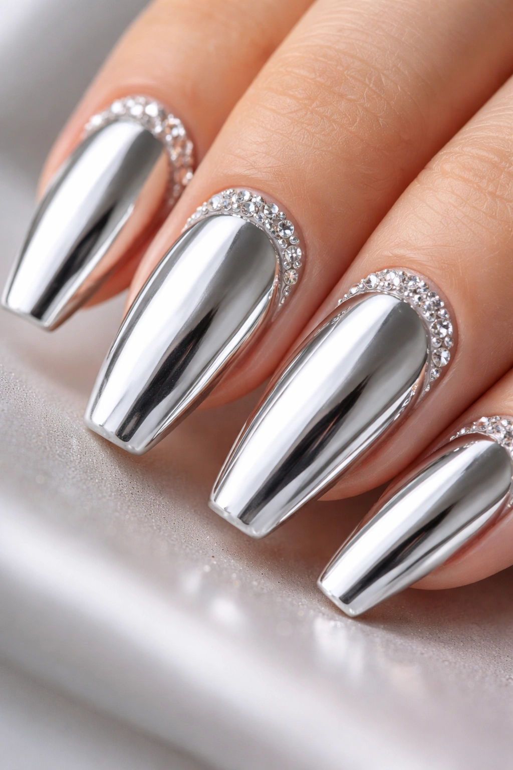 Nail with crystal cuticle arc on silver mirror base
