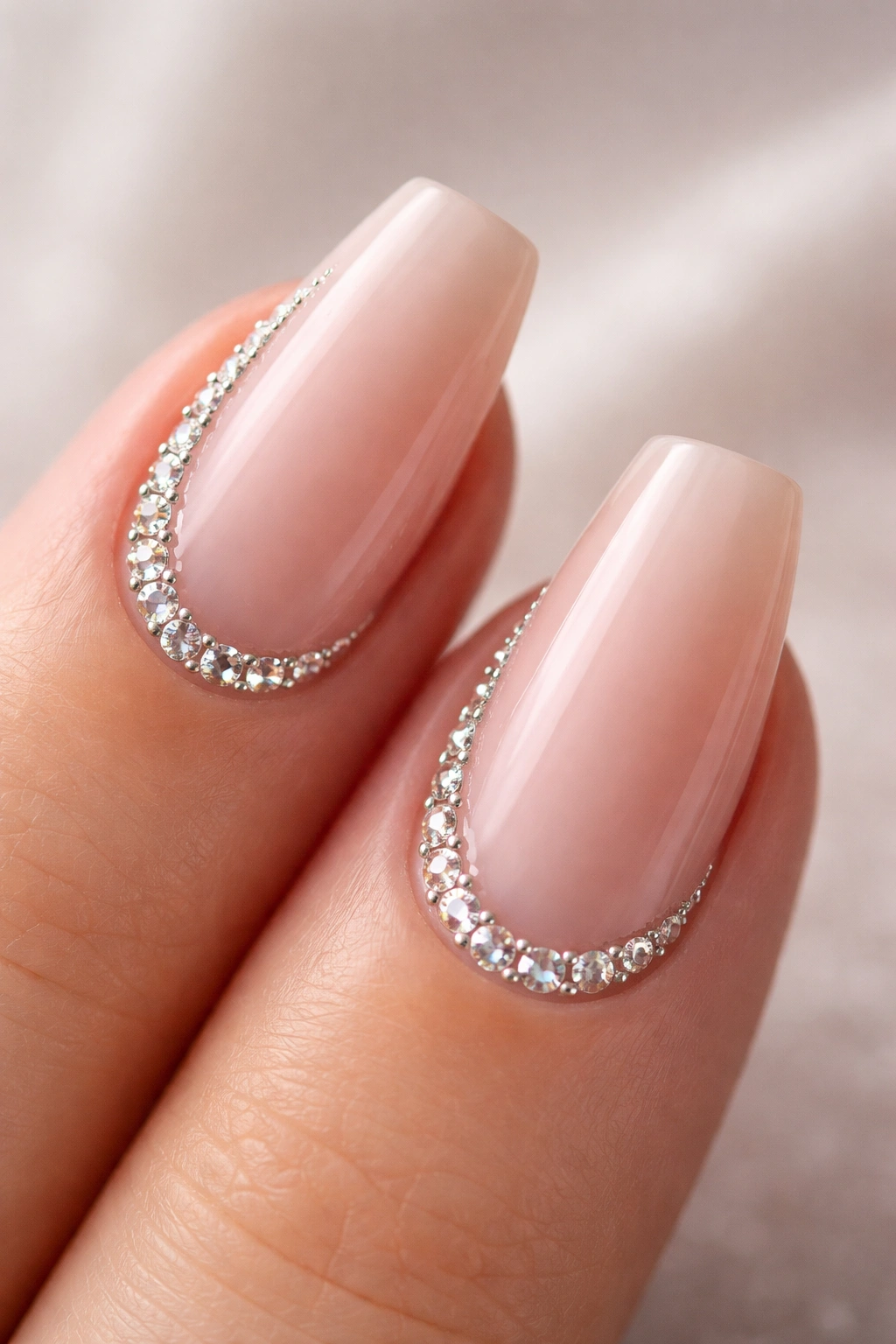 Crescent crystal frame along cuticle on nude coffin nails