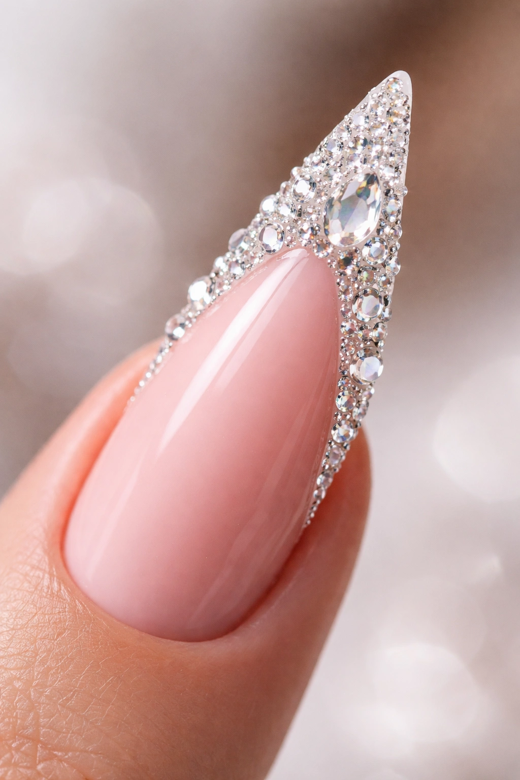Stiletto nail with large crystal stones along the white tip