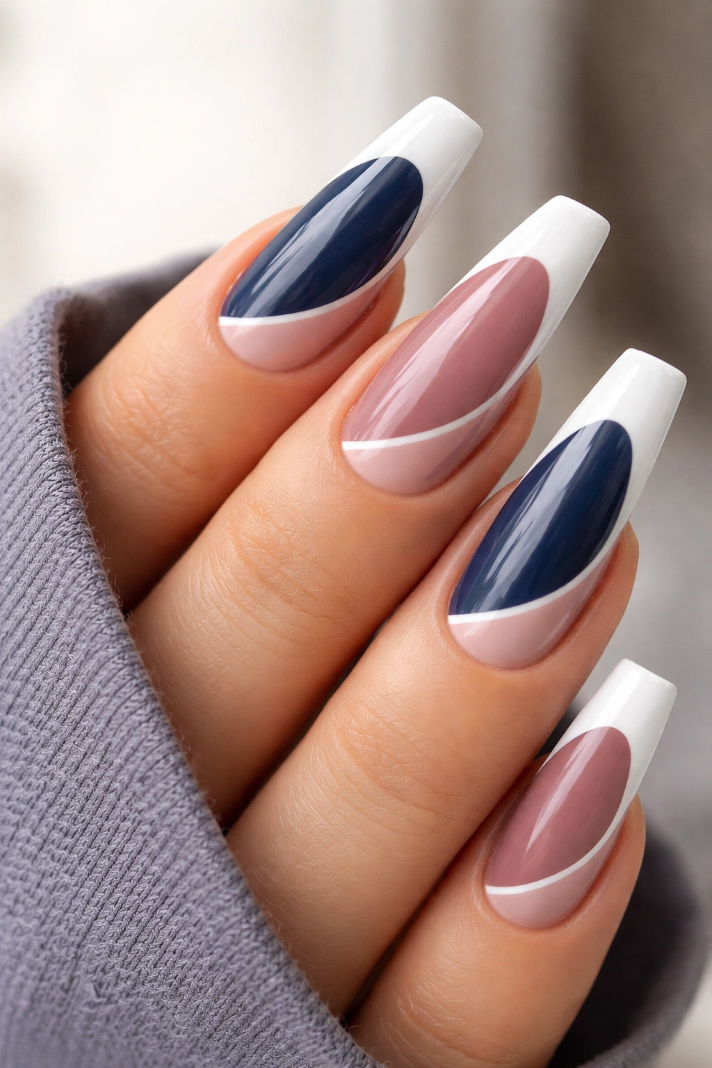 Reverse stiletto nails with curved color block French tip