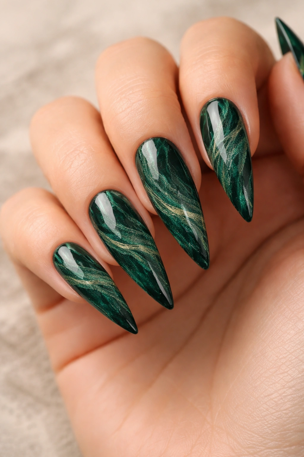 Dark green marble pattern stiletto nails