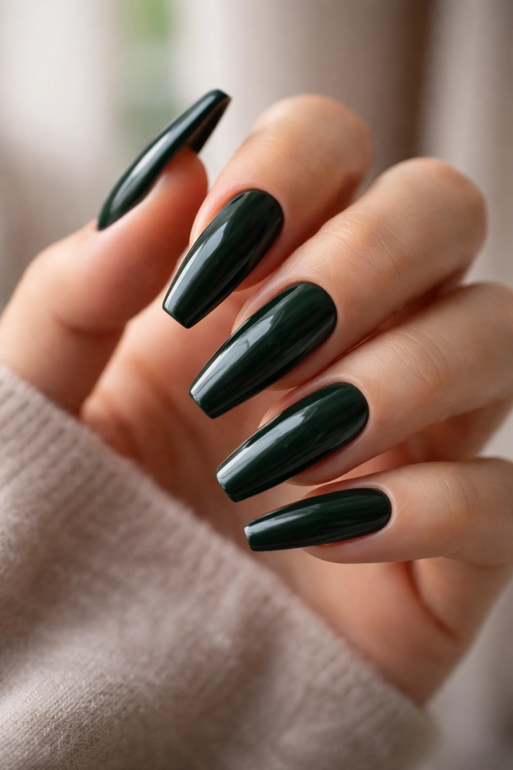 Close-up of dark green ballerina nails showing depth and undertones