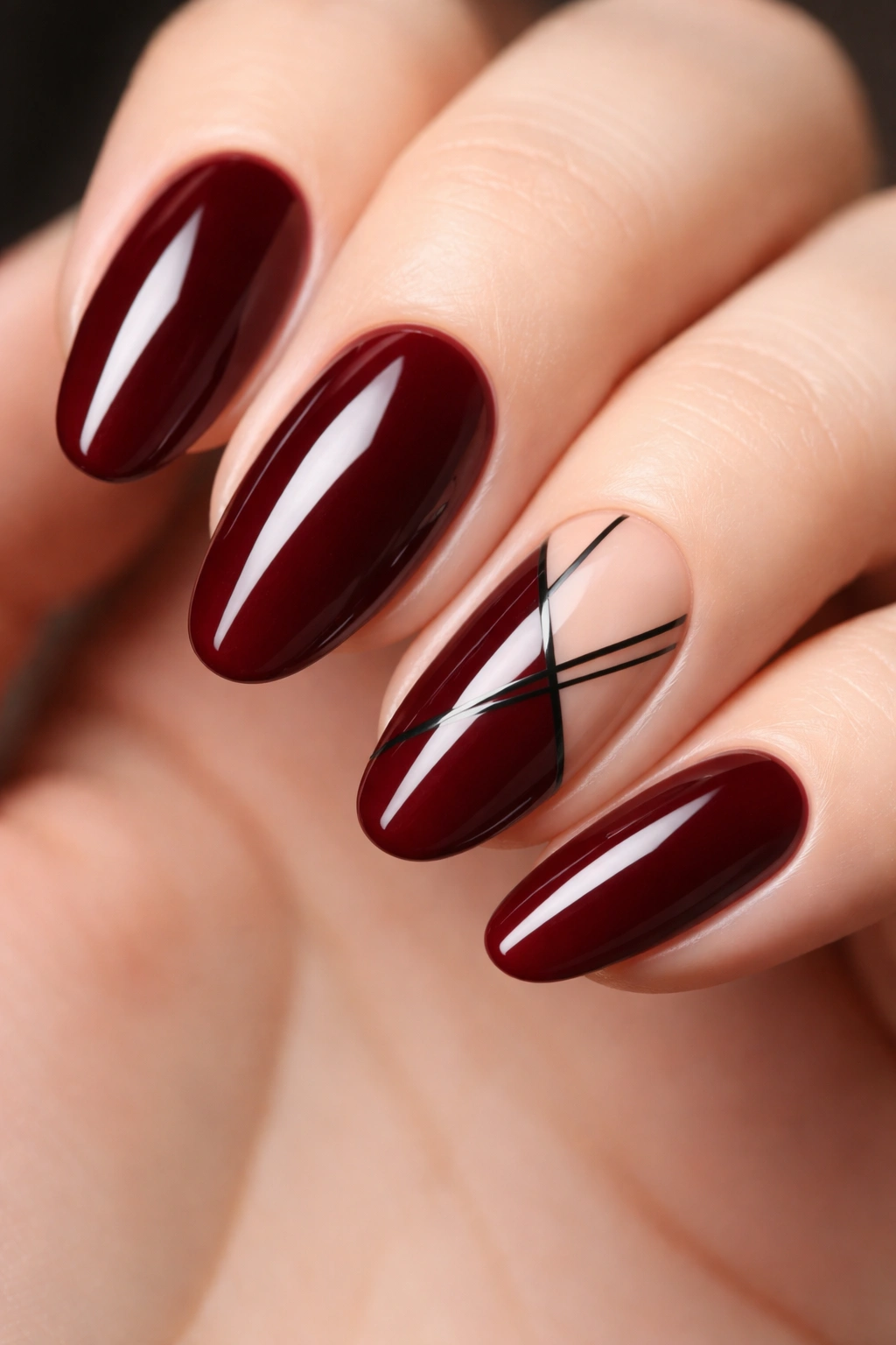 Dark red nails with black geometric details