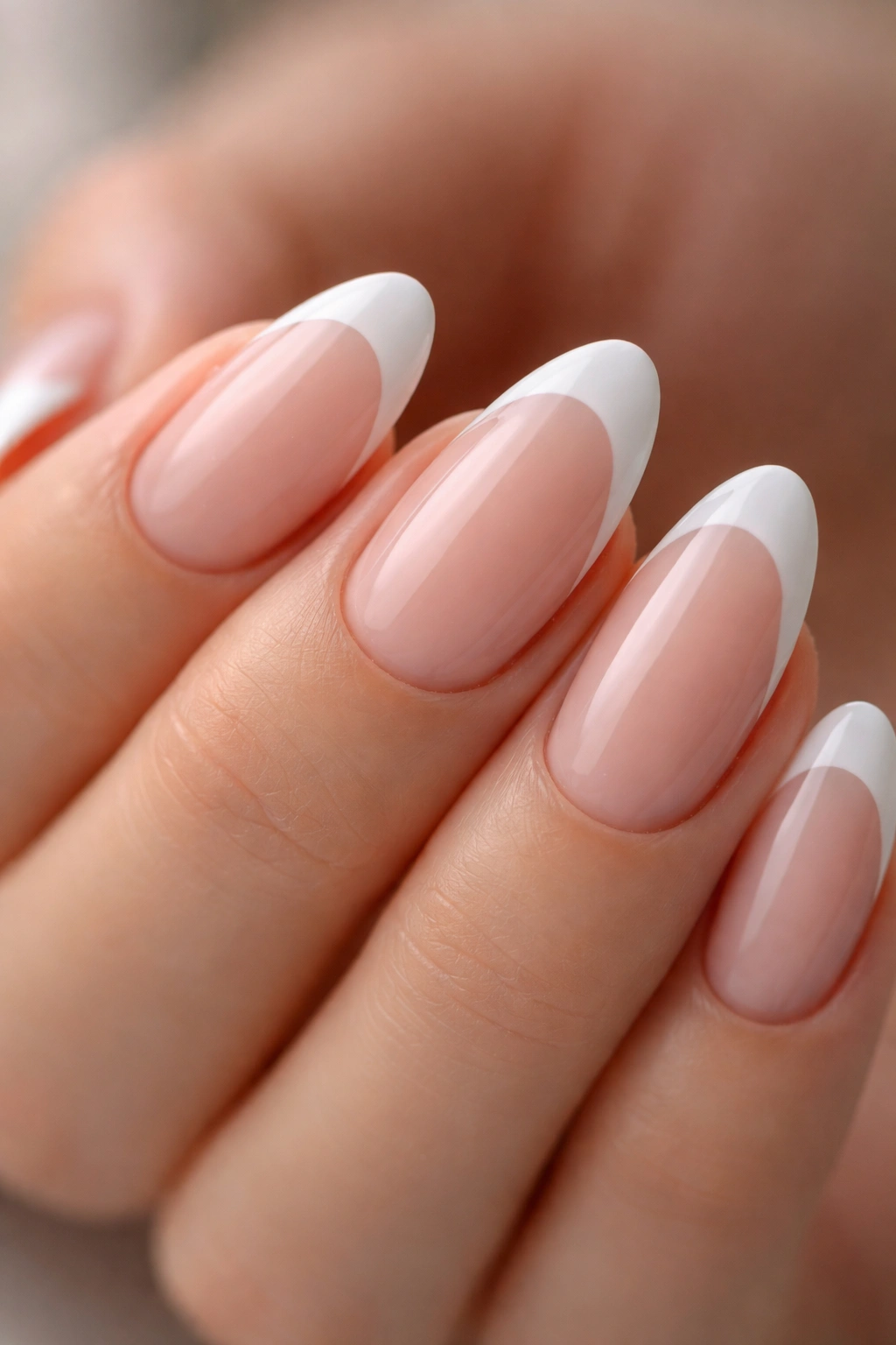 Close-up of nails with crisp white French line created with dip powder