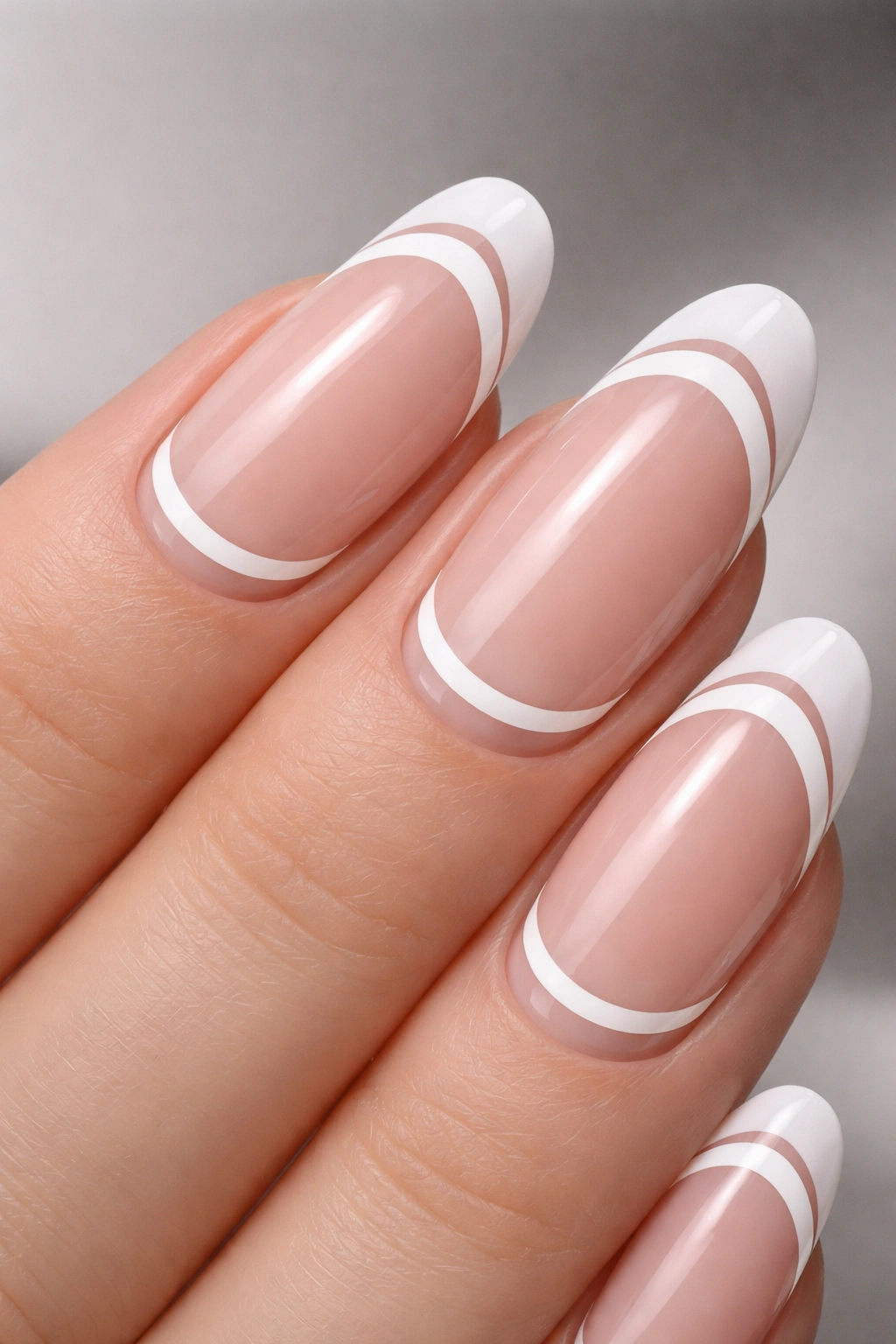Nail featuring two crisp white French tips and negative space