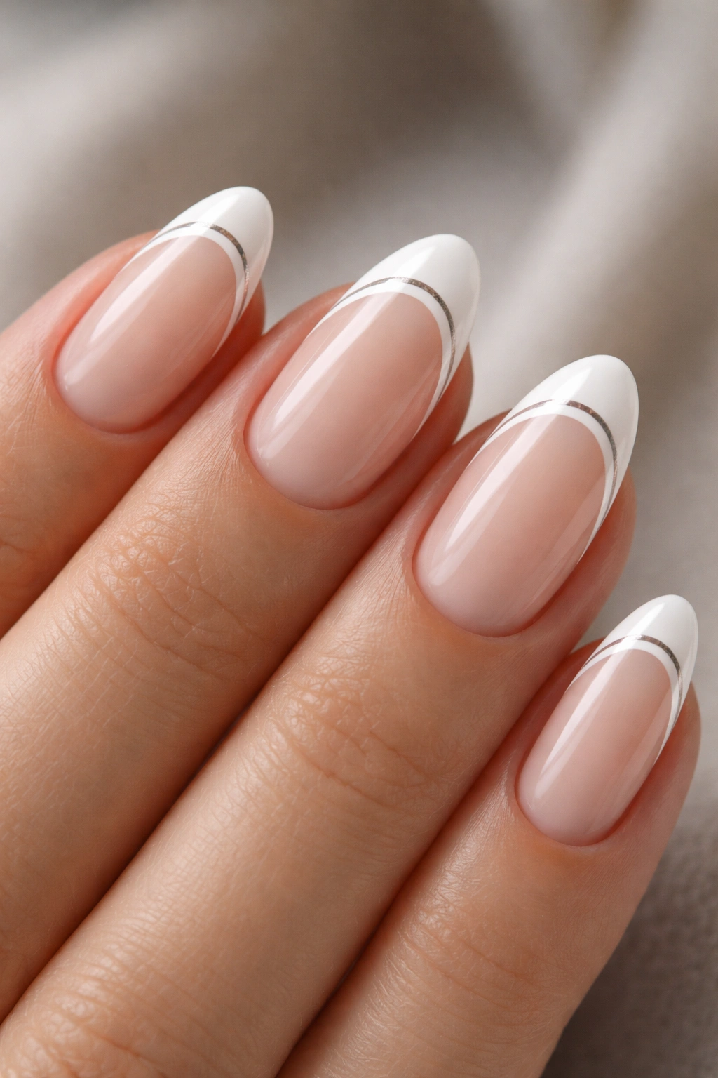 Short almond nails with two parallel lines at the tip area