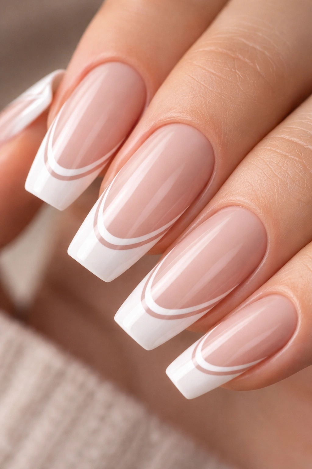Close-up of ballerina nail with double thin white lines and tiny nude gap