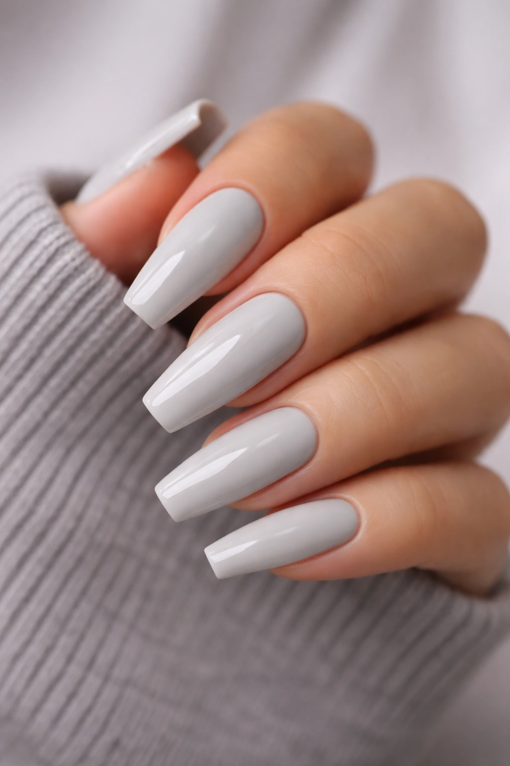 Dove grey cream nails on long ballerina shape with glossy finish