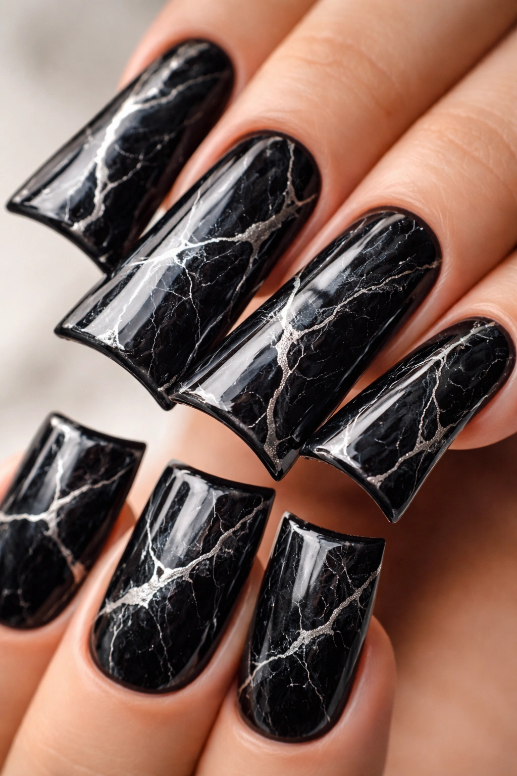Duck nails with black marble design and silver veins