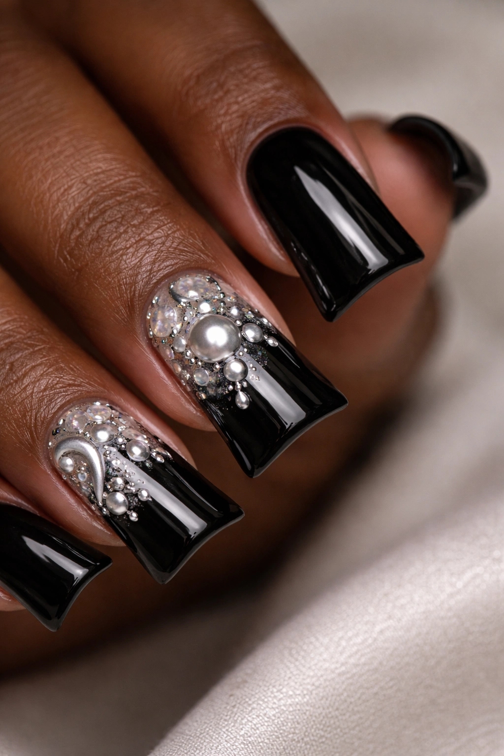 Black duck nails with pearl and chrome accents