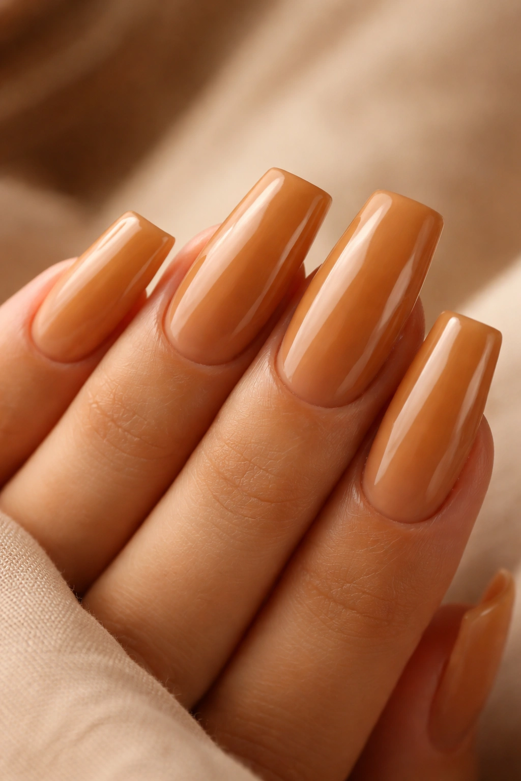 Close-up of duck nails in warm honey tone with natural depth