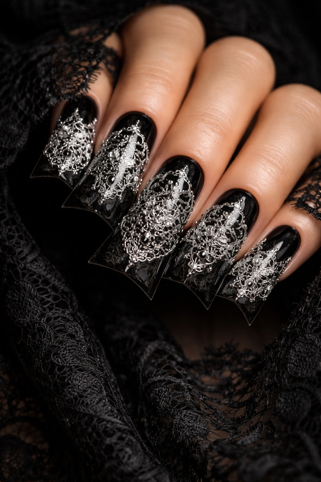 Duck nails with white and metallic lace on black background