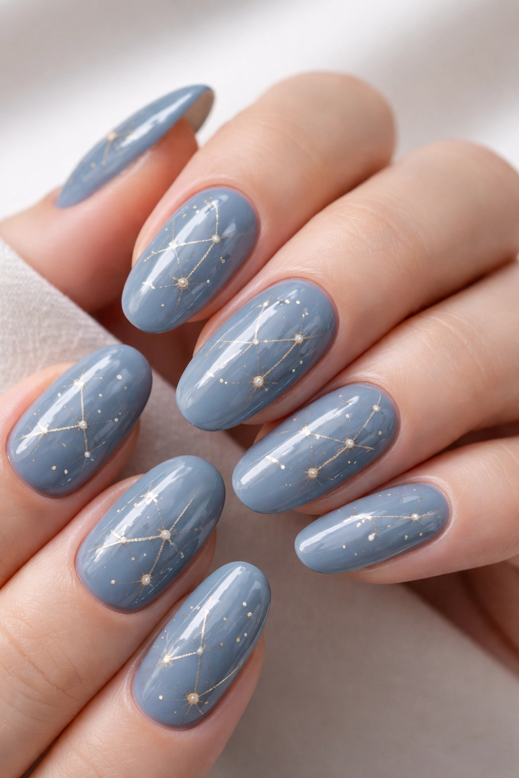 Dusty blue nails with constellation line design