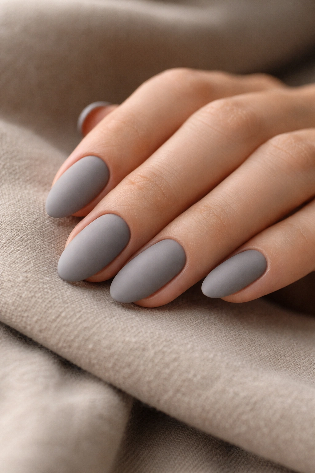 Short almond nails in dusty grey matte finish