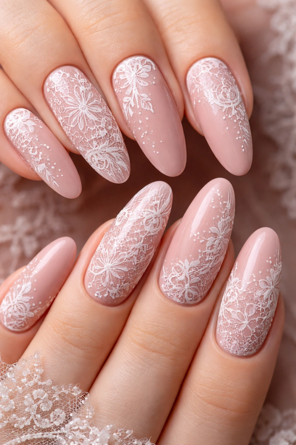 Dusty rose oval nail with intricate white lace design