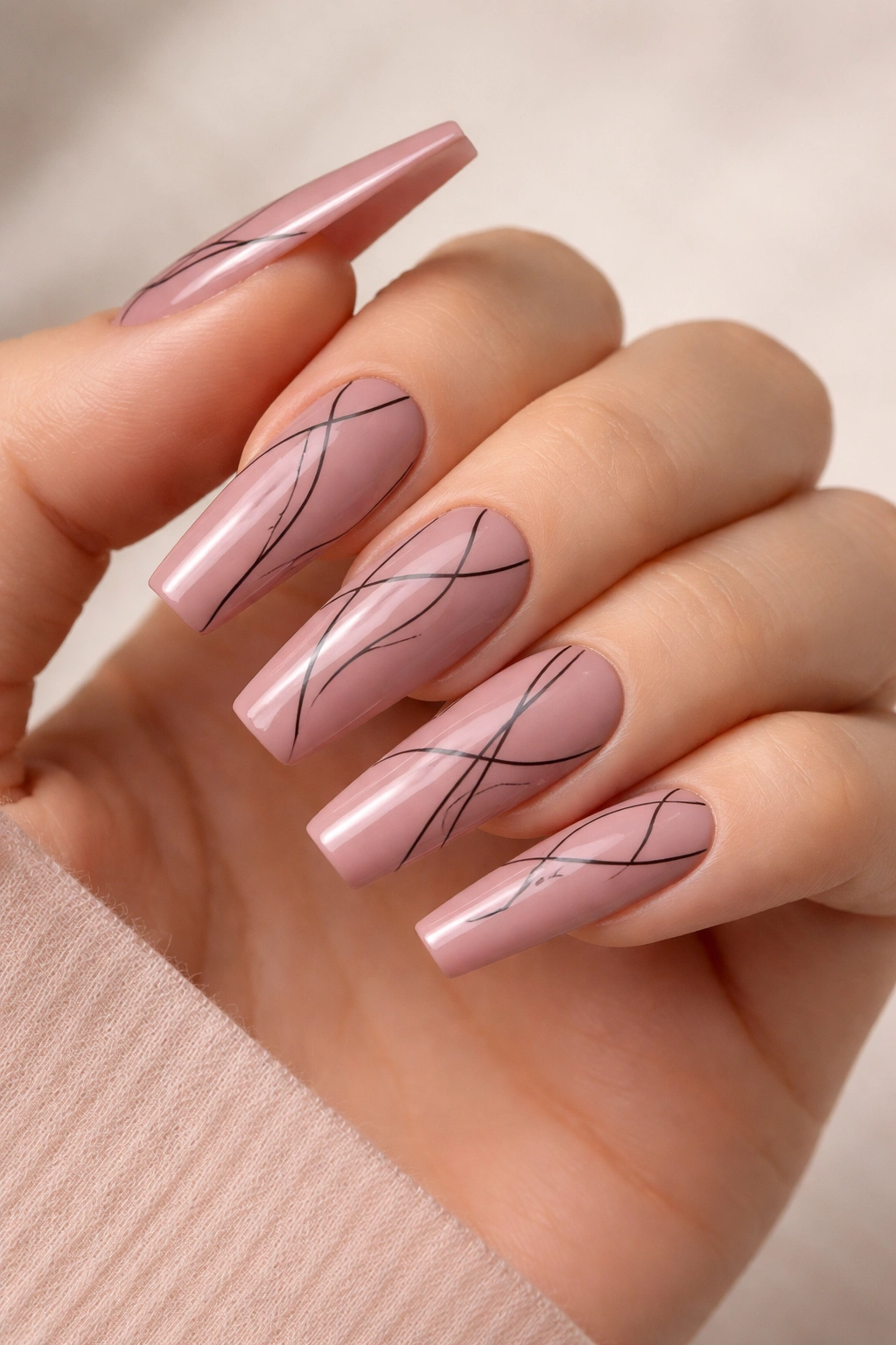 Dusty rose coffin nails with minimalist black line art
