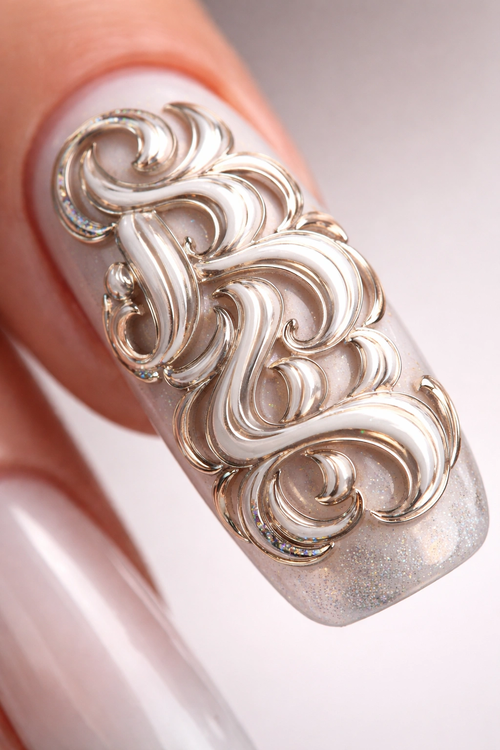 Close-up of raised 3D lettering on nail surface