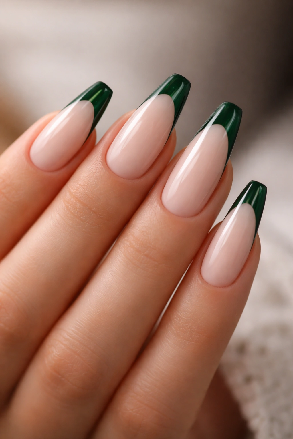 Emerald French tip nails on milky nude base