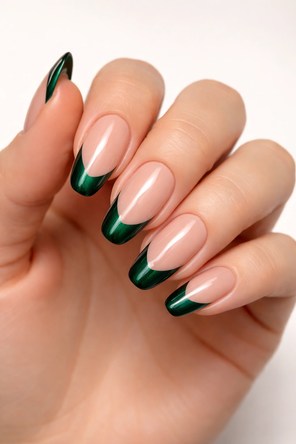 Emerald green French tips on nude base nails