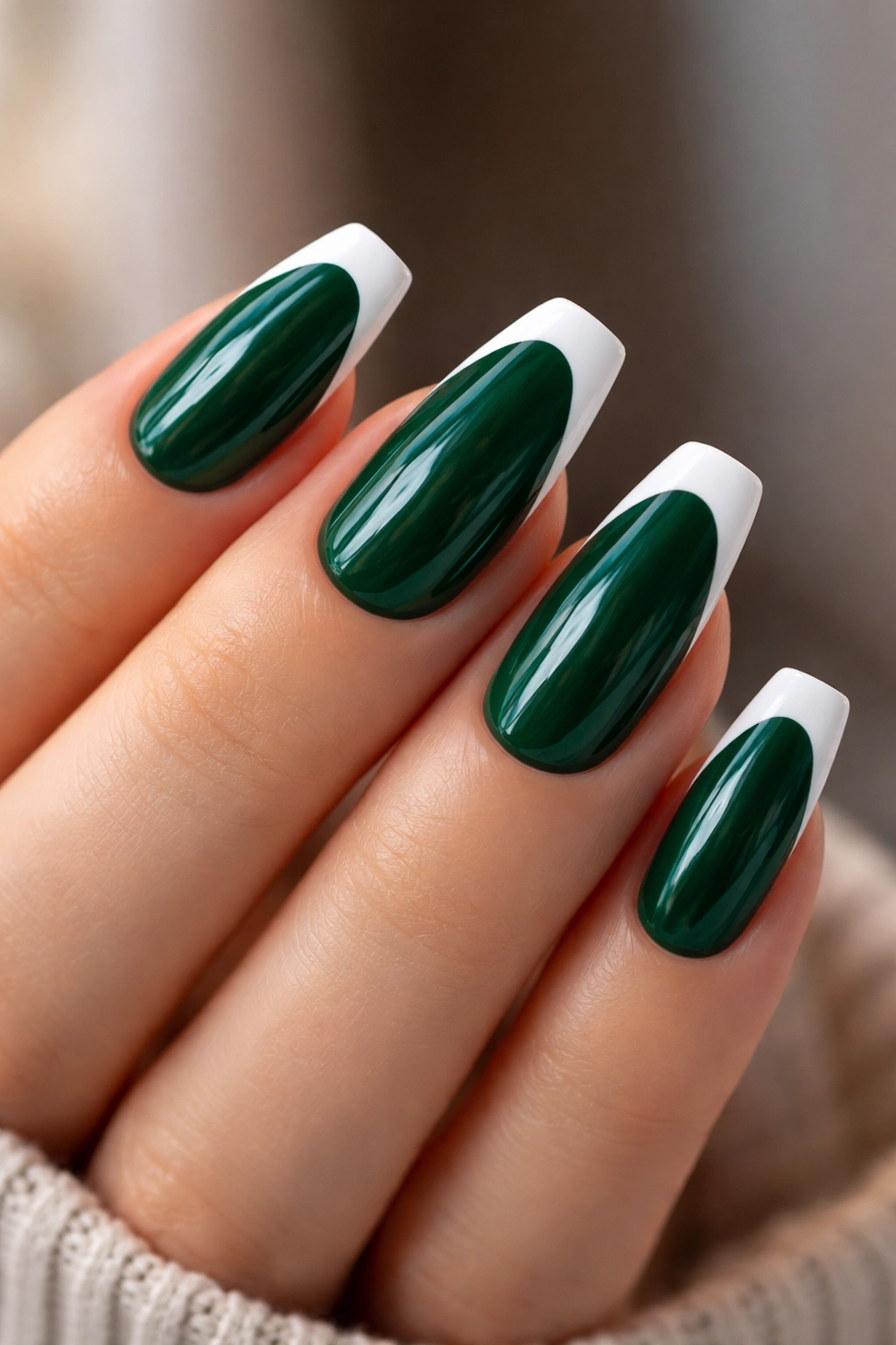 Medium coffin nails with emerald base and white tips in close-up