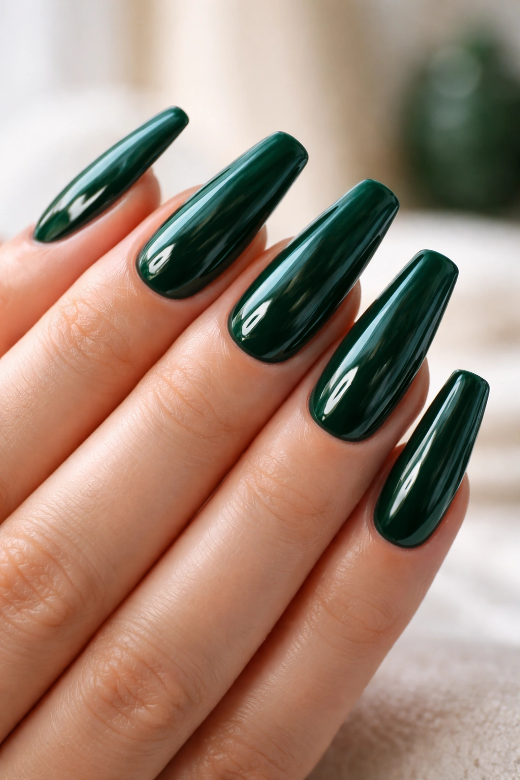 Glossy emerald ballerina nails with high-shine finish