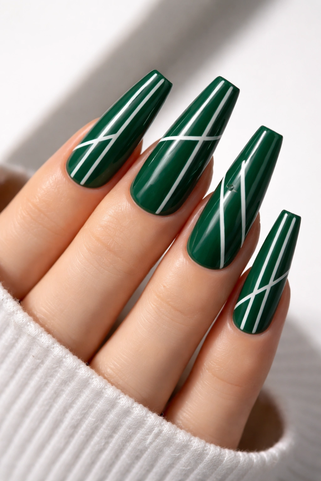 Emerald emerald coffin nails with white geometric lines close-up
