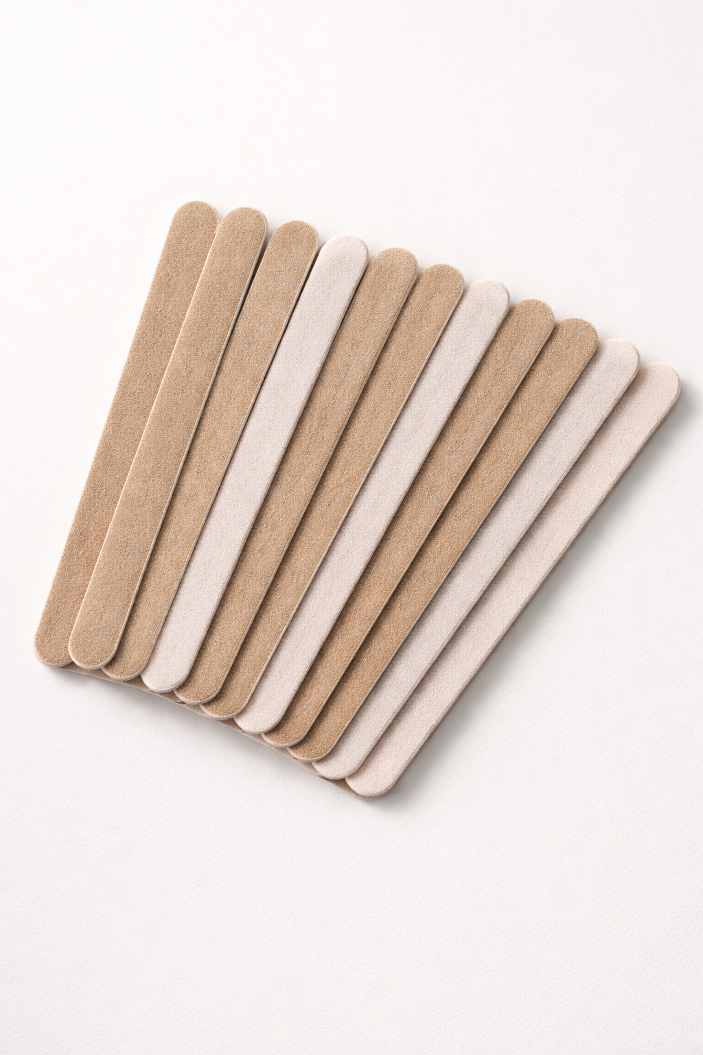 Row of compact emery boards on light background