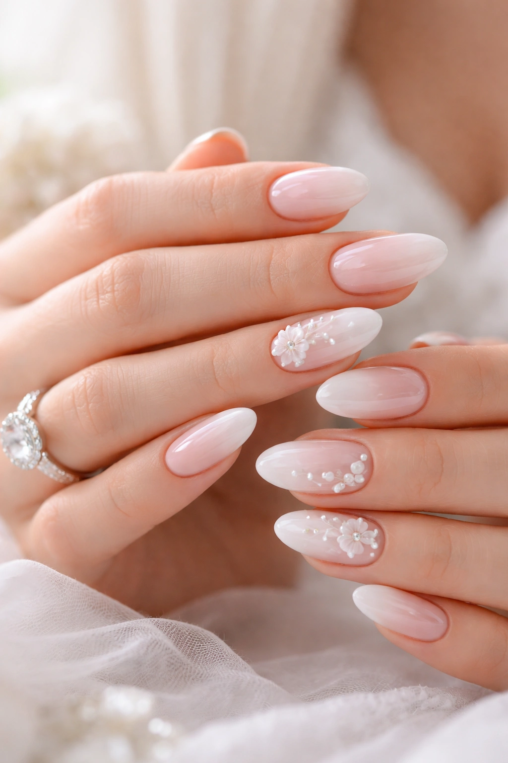 Close-up of hands with impeccably manicured nails, front-and-center for engagement photos