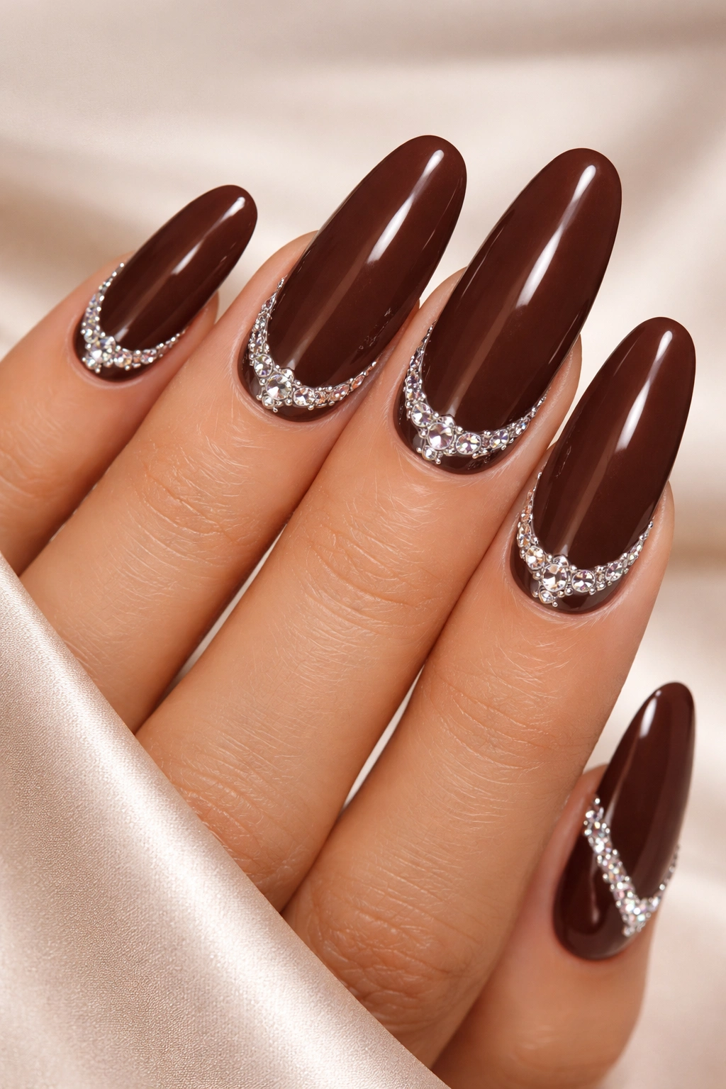 Espresso brown nails with rhinestones along cuticle and tips for sparkle.
