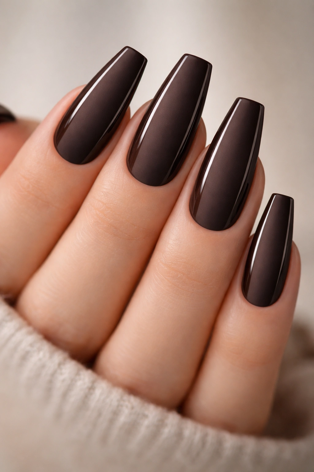 Espresso nails with narrow glossy side panels on a matte base.